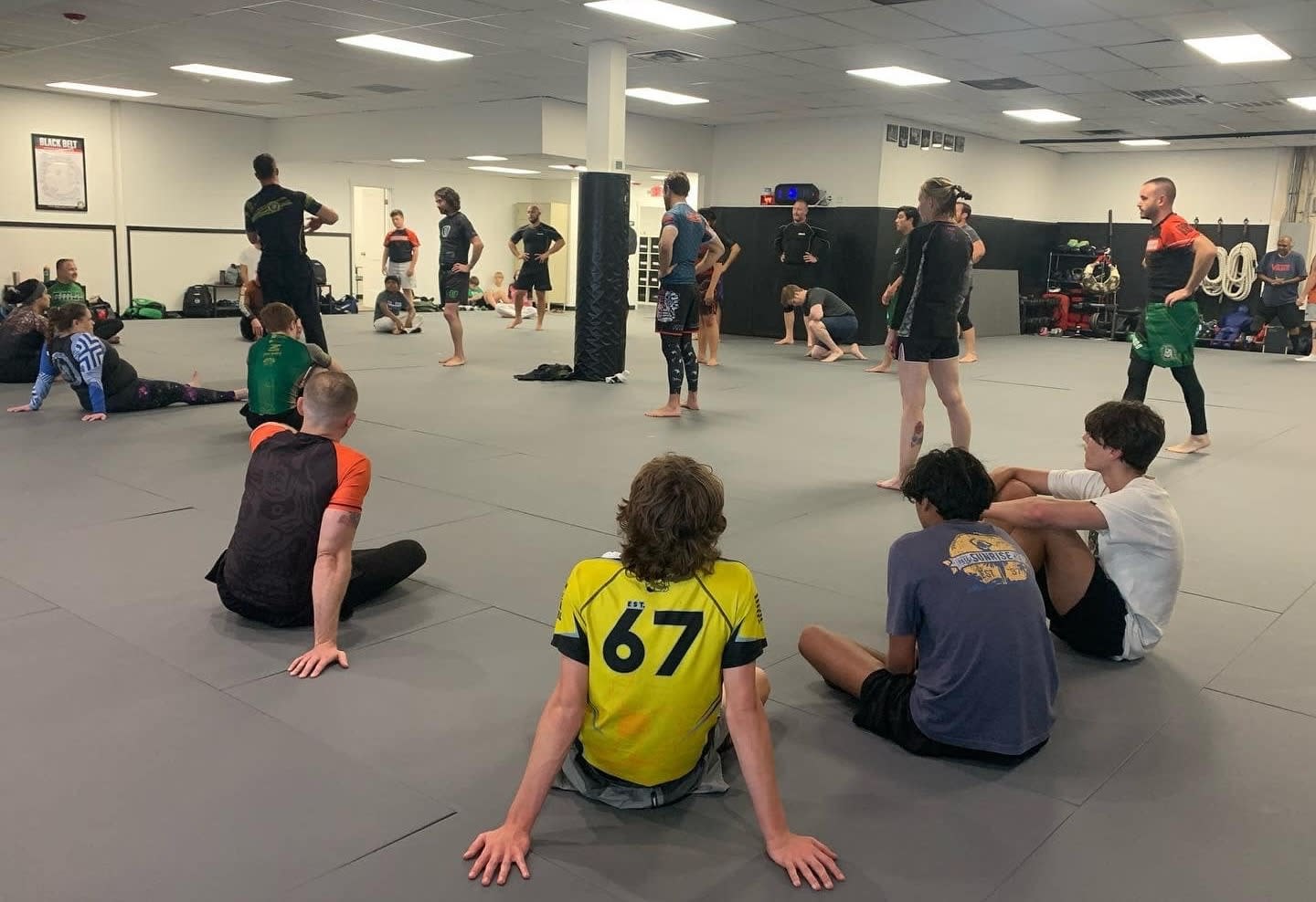 Martial arts instructor coaching students with high standards