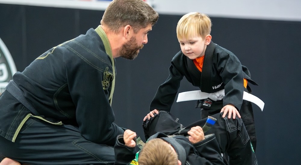 Kid building confidence through martial arts at Carlos Machado Jiu Jitsu - The Colony